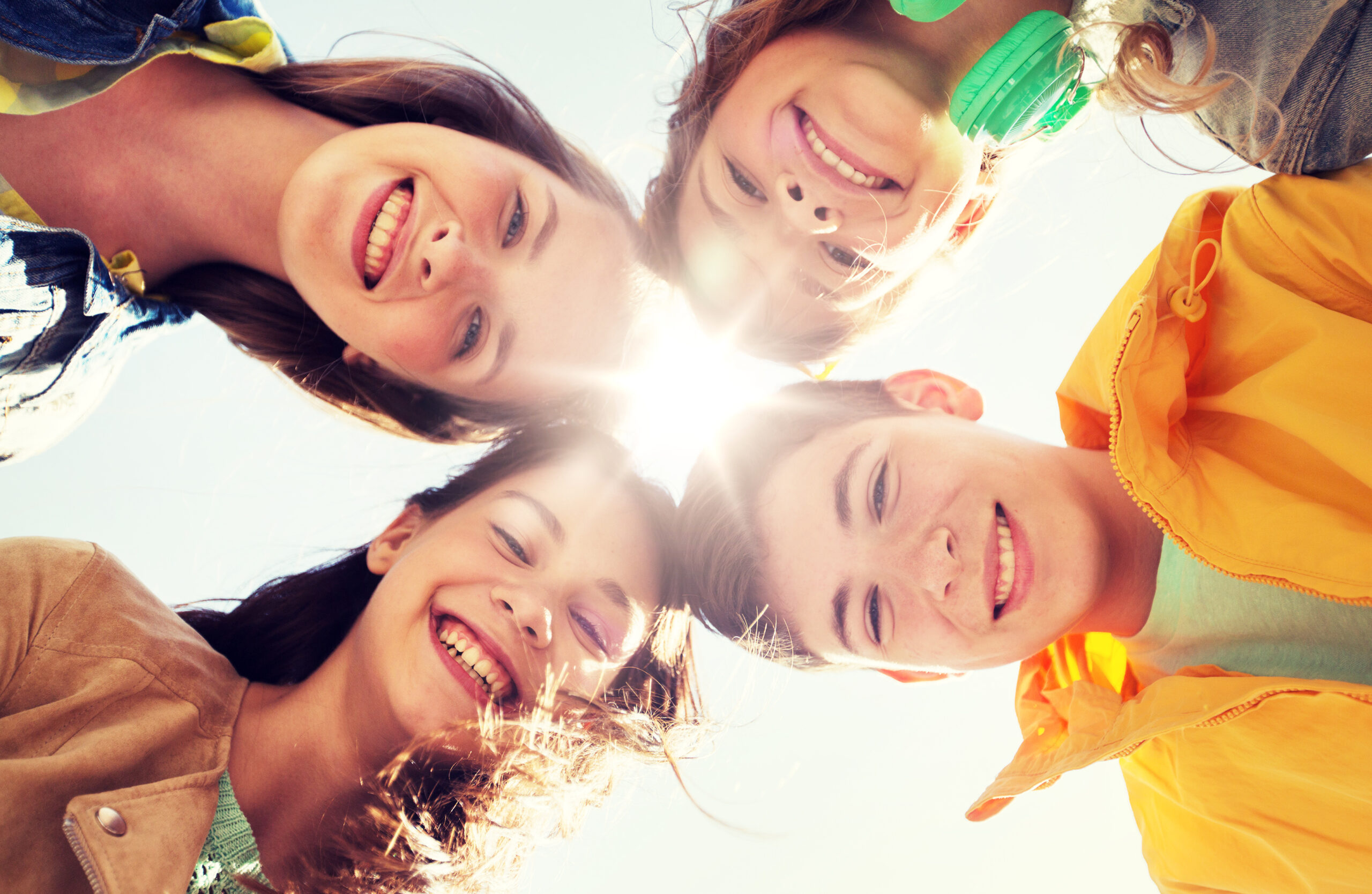 group of happy teenage friends